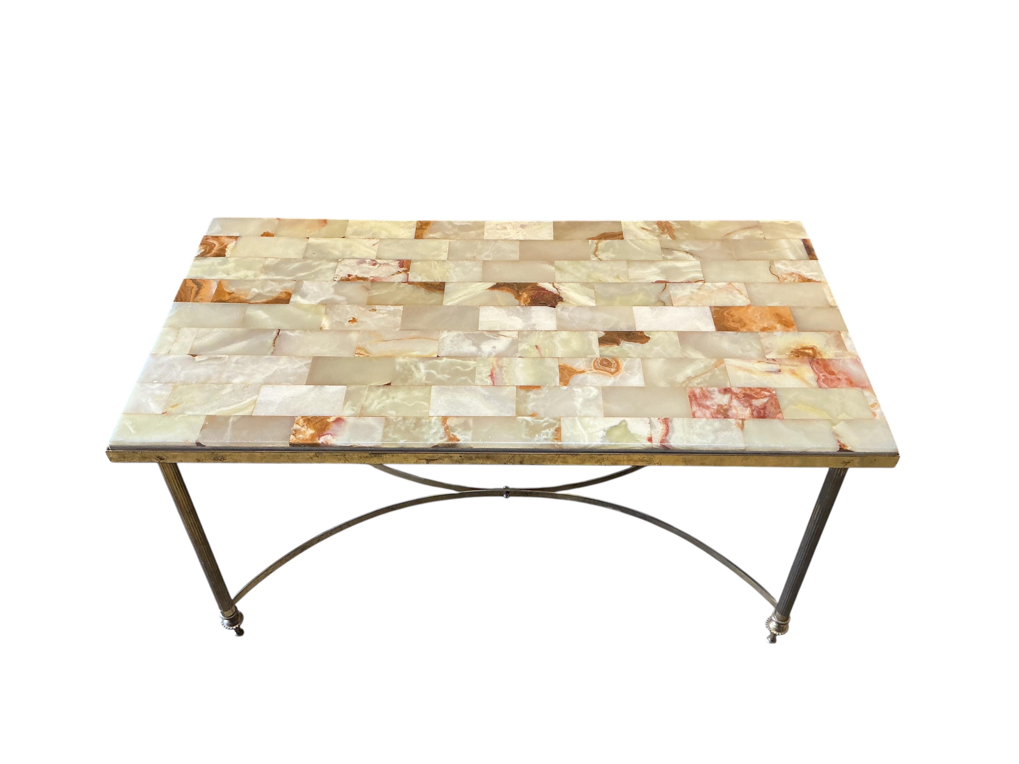 A rectangular brass and onyx coffee table, width 87cm, depth 46cm, height 42cm